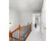 Hallway upstairs featuring wood and metal railing and neutral carpet at 4883 Seldon Se Way, Smyrna, GA 30080