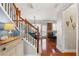 Hallway entrance with staircase and view into kitchen with bar stool seating at 4883 Seldon Se Way, Smyrna, GA 30080