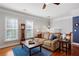 Cozy living room features hardwood floors, lots of windows, and a neutral color palette at 4883 Seldon Se Way, Smyrna, GA 30080