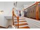 Elegant staircase with wooden treads and decorative iron railing leading to the upper level at 4883 Seldon Se Way, Smyrna, GA 30080