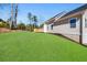 Exterior view of the backyard featuring a well-manicured lawn and a wooden deck at 939 Whistler Ln, Canton, GA 30114