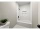 Bathroom featuring a bathtub with tile surround and black fixtures at 939 Whistler Ln, Canton, GA 30114