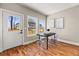 Light-filled dining area featuring wood floors, modern chairs, and backyard views at 939 Whistler Ln, Canton, GA 30114