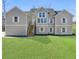 Charming two-story home featuring double-hung windows and a well-manicured lawn at 939 Whistler Ln, Canton, GA 30114