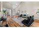 Bright living room with vaulted ceilings, hardwood floors, and contemporary furniture at 939 Whistler Ln, Canton, GA 30114