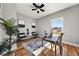 Bright home office with hardwood floors, ceiling fan, and ample natural light from the large window at 939 Whistler Ln, Canton, GA 30114