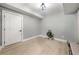 This room features wood-look floors, a modern light fixture, and fresh paint at 939 Whistler Ln, Canton, GA 30114