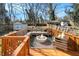 Backyard wooden deck with comfortable outdoor sectional sofa and fire pit at 1547 Melrose Sw Dr, Atlanta, GA 30310