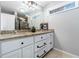 Bathroom with granite countertop vanity and framed mirror at 1547 Melrose Sw Dr, Atlanta, GA 30310