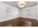 Bright bedroom with hardwood floors, two windows, and neutral walls at 1547 Melrose Sw Dr, Atlanta, GA 30310