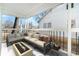Covered patio with comfortable sectional seating and modern fire pit at 1547 Melrose Sw Dr, Atlanta, GA 30310