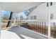 Covered porch with a view of the front yard, featuring black railing at 1547 Melrose Sw Dr, Atlanta, GA 30310