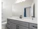 Bathroom with gray vanity, white countertop, and a large mirror at 1991 Hollywood Nw Rd # 14, Atlanta, GA 30318