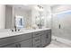 Modern bathroom featuring dual sinks, quartz countertops, and glass shower at 1991 Hollywood Nw Rd # 14, Atlanta, GA 30318