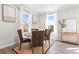 Cozy dining room featuring a round table, four chairs, and large windows that brings in natural light at 1991 Hollywood Nw Rd # 14, Atlanta, GA 30318