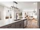 Bright, open kitchen with stainless steel appliances, grey cabinets, and large island with quartz countertops at 1991 Hollywood Nw Rd # 14, Atlanta, GA 30318