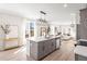 Open kitchen with a large island, stainless steel appliances, and a seamless flow to the living room at 1991 Hollywood Nw Rd # 14, Atlanta, GA 30318