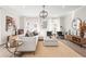 Bright and airy living space with a large sectional sofa, modern decor, and access to an outdoor patio at 1991 Hollywood Nw Rd # 14, Atlanta, GA 30318