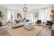 Bright and airy living room featuring a white sofa, modern decor, and lots of natural light at 1991 Hollywood Nw Rd # 14, Atlanta, GA 30318