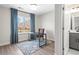 Office with a dark desk, gray cabinets, and large window at 1991 Hollywood Nw Rd # 14, Atlanta, GA 30318