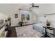 Upstairs bedroom with sloped ceilings, wood floors, and natural light at 2005 College Ne Ave, Atlanta, GA 30317