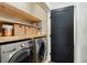 Laundry room featuring LG washer and dryer with wooden shelving above at 2005 College Ne Ave, Atlanta, GA 30317