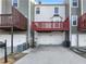 Rear view of townhomes with private decks and attached garages at 1235 Park Pass Way, Suwanee, GA 30024