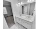 Bathroom featuring double sink vanity, marble floor and neutral wall color at 1235 Park Pass Way, Suwanee, GA 30024