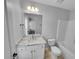 Clean bathroom with vanity, marble countertop and shower-tub combo at 1235 Park Pass Way, Suwanee, GA 30024