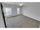 Bright bedroom with neutral carpet, and natural light at 1235 Park Pass Way, Suwanee, GA 30024