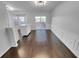 Bright dining room with hardwood floors and sliding glass doors to the outdoor deck at 1235 Park Pass Way, Suwanee, GA 30024