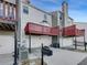 View of the exterior featuring gray tones, balconies and garage doors at 1235 Park Pass Way, Suwanee, GA 30024