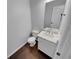 A beautifully decorated half bathroom with a marble sink and a modern toilet at 1235 Park Pass Way, Suwanee, GA 30024