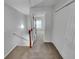 Hallway with carpeted floors featuring staircase and doorway views with modern white trim at 1235 Park Pass Way, Suwanee, GA 30024