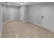 Bright living room featuring tile flooring, white front door and closet at 1235 Park Pass Way, Suwanee, GA 30024