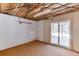 Unfinished basement with sliding glass door to pool at 2011 Two Springs Way, Lawrenceville, GA 30043