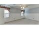 Bedroom featuring wainscoting, light carpet, and windows with shutter blinds at 2011 Two Springs Way, Lawrenceville, GA 30043