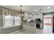 Kitchen featuring updated appliances, granite countertops, and mosaic backsplash at 2011 Two Springs Way, Lawrenceville, GA 30043