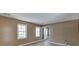 Neutral living room featuring bright windows and light-colored floors near the front entrance at 2011 Two Springs Way, Lawrenceville, GA 30043