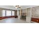 Cozy living room with a brick fireplace, built-in bookshelves, and large bay windows for natural light at 2011 Two Springs Way, Lawrenceville, GA 30043