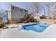 Backyard view of private pool with patio and house in the background at 2011 Two Springs Way, Lawrenceville, GA 30043