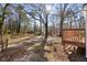 Spacious, tree-filled backyard with direct access to a wooden deck at 248 N Lake Dr, Jonesboro, GA 30236