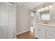 Bathroom with wood floors and white cabinets and a closet space at 248 N Lake Dr, Jonesboro, GA 30236