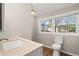 Bright bathroom with wood floors and a clear view of the backyard at 248 N Lake Dr, Jonesboro, GA 30236