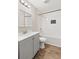 This bathroom features gray vanity, white subway tile and a shower/tub combo at 248 N Lake Dr, Jonesboro, GA 30236