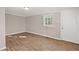 Bedroom featuring wood floors and a bright white door to the outside at 248 N Lake Dr, Jonesboro, GA 30236