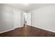 This bedroom offers hardwood floors, modern paint, and a closet at 248 N Lake Dr, Jonesboro, GA 30236