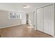 Bedroom with wood floors and a view into the hallway and closet space at 248 N Lake Dr, Jonesboro, GA 30236