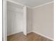 White bedroom closet with wood floors and white shelving at 248 N Lake Dr, Jonesboro, GA 30236