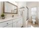 Cozy bathroom featuring a vanity with marble countertop, tile floor, and a shower and bathtub combo at 2704 Loring Nw Rd, Kennesaw, GA 30152